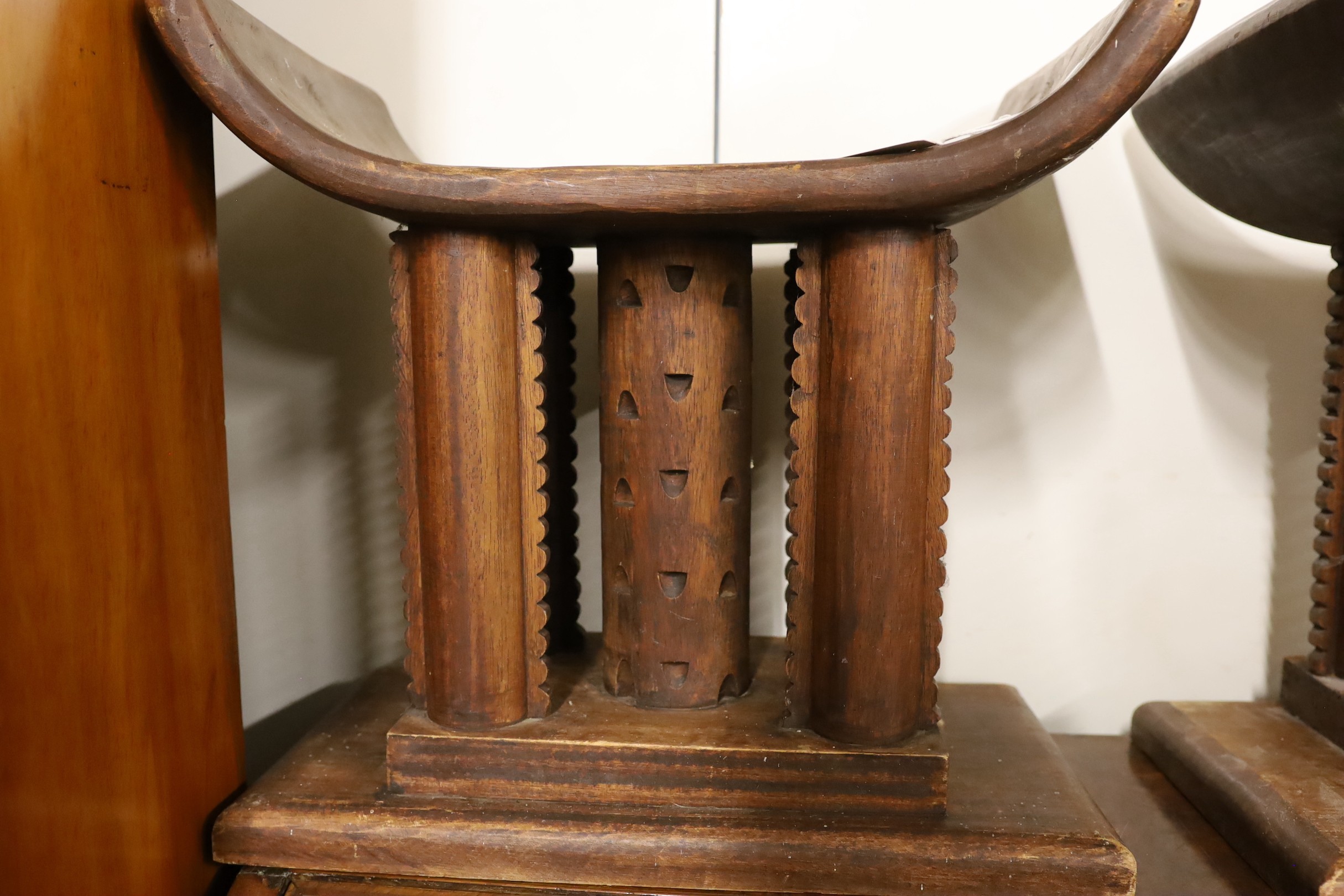 A pair of African carved hardwood stools, width 46cm, depth 29cm, height 43cm